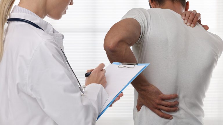 injured spine, back injury, doctor physio Reading Personal Injury Solicitors